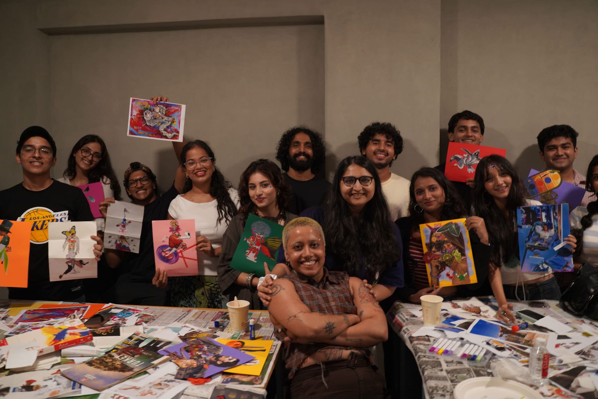 Rising Tide members showing off their finished collage pieces